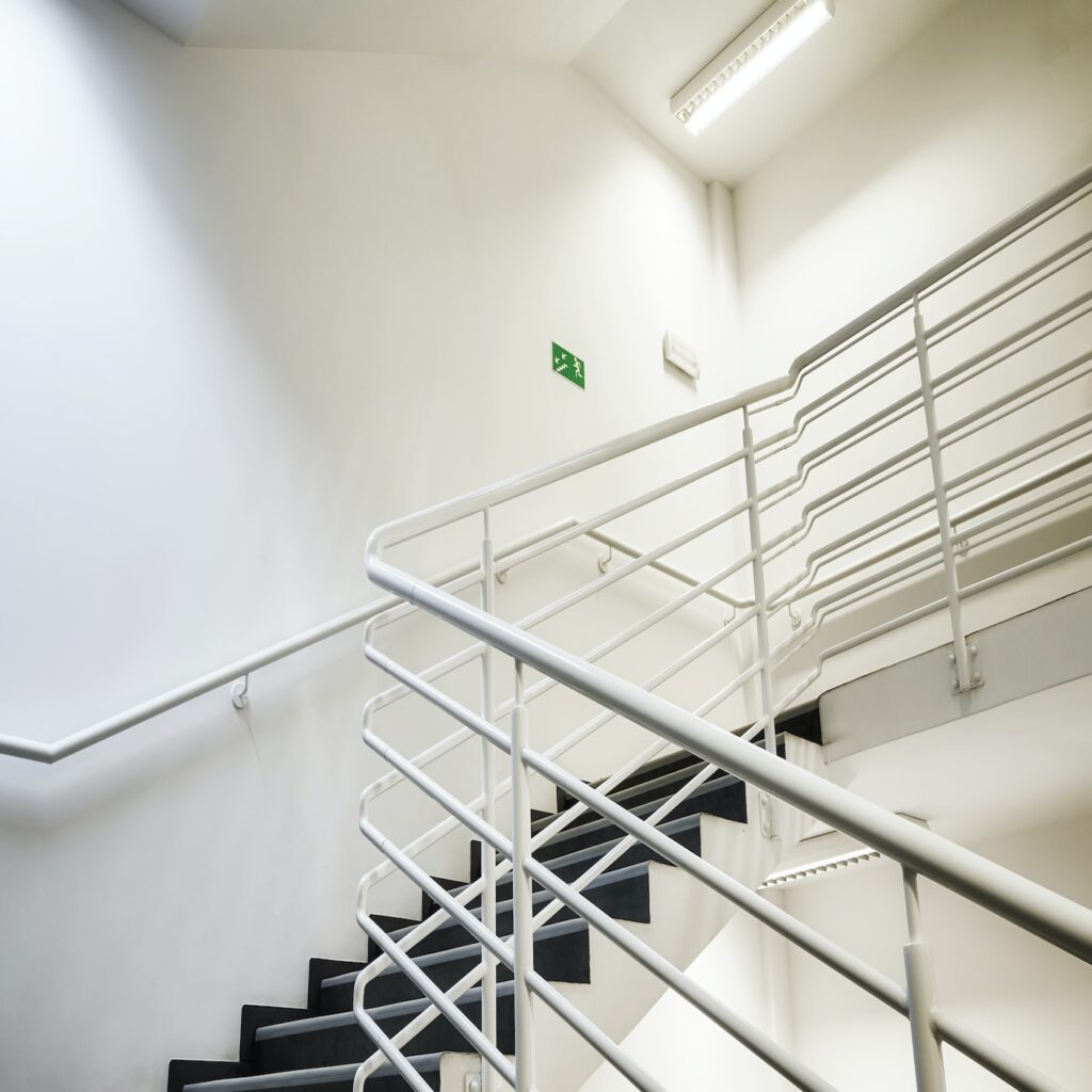 Modern empty staircase with white wall.